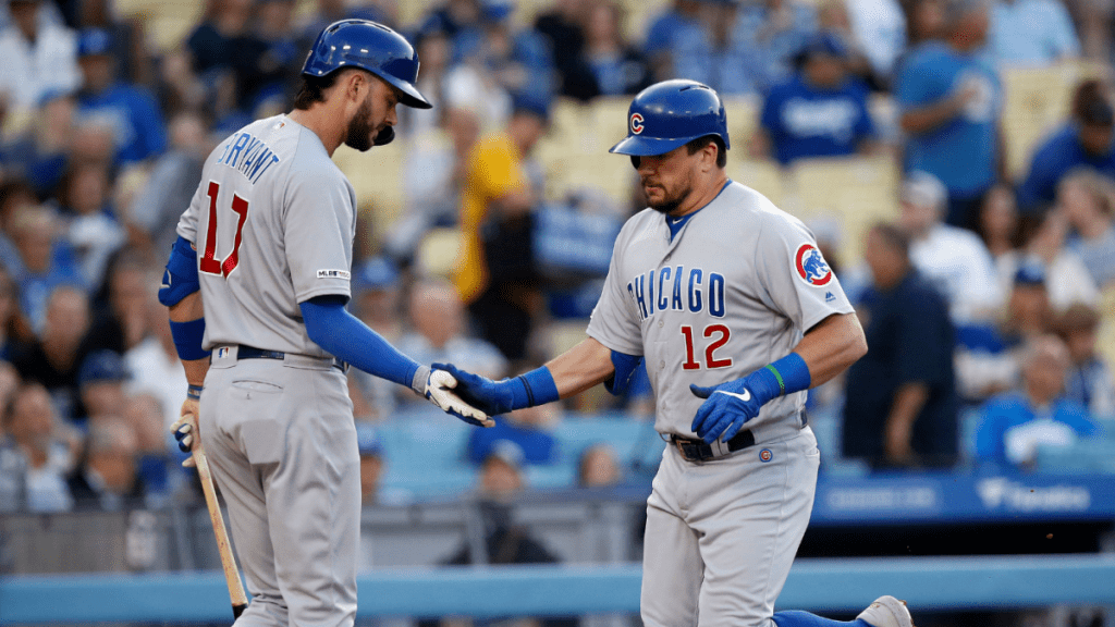 Kyle Schwarber celebrates with Bryant