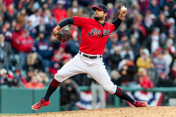 Brad Hand pitches for Indians