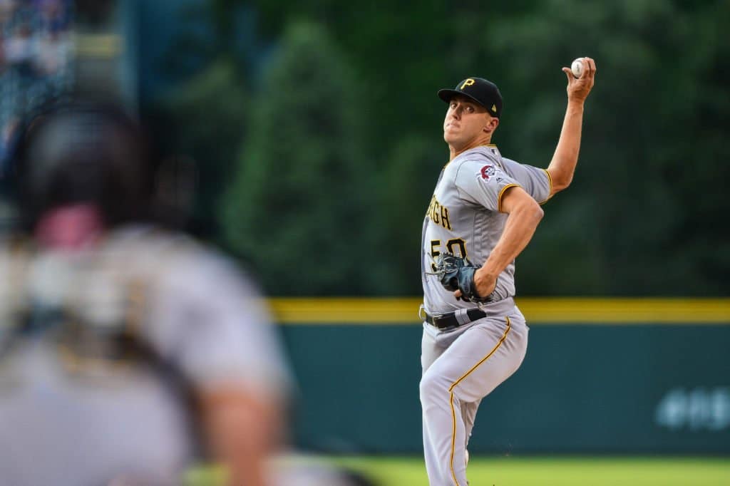 Jameson Taillon throws pitch