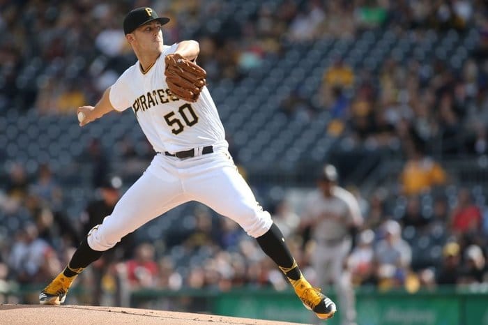 Jameson Taillon throws pitch